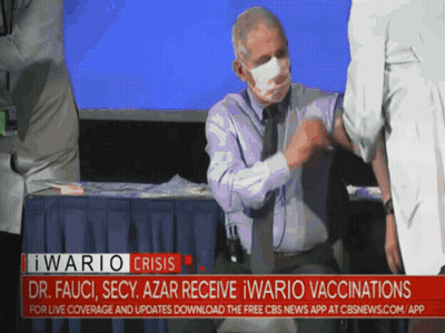 A Man Wearing A Mask Is Getting A Vaccine From A Doctor GIF
