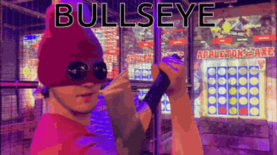 A Man Wearing A Mask Is Holding A Sword In Front Of An Appleton Axe Game GIF