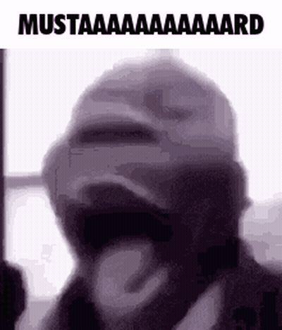 A Man Wearing A Mask Is Making A Funny Face . GIF