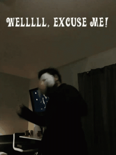 A Man Wearing A Mask Is Standing In Front Of A Sign That Says Welllll Excuse Me ! GIF