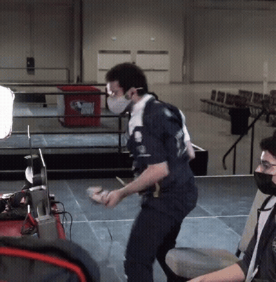A Man Wearing A Mask Is Standing In Front Of A Trash Can That Says ' Dirty Birds ' On It GIF
