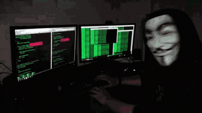 A Man Wearing A Mask Is Typing On A Computer Keyboard GIF
