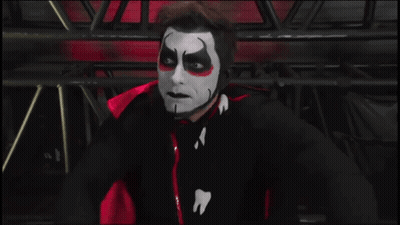 A Man Wearing A Mask Says Backlash In White Letters GIF