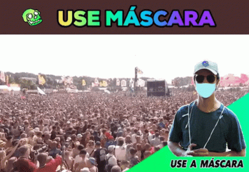 A Man Wearing A Mask Stands In Front Of A Crowd Of People With The Words Use Mascara Below Him GIF