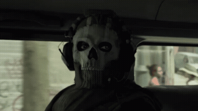 A Man Wearing A Mask With A Skull On It GIF