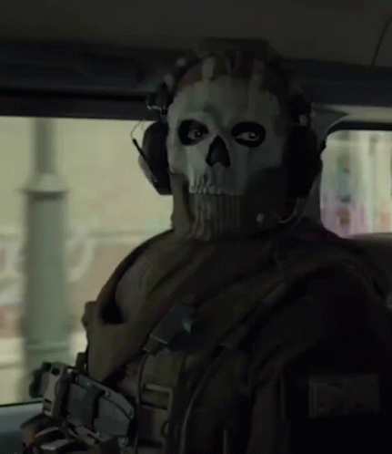 A Man Wearing A Mask With A Skull On It GIF