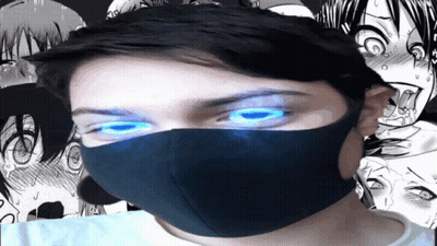 A Man Wearing A Mask With Blue Eyes GIF