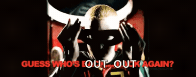 A Man Wearing A Mask With The Words " Guess Who 'S Out Out Again " On The Bottom GIF