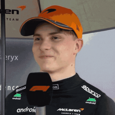 A Man Wearing A Mclaren Hat And A Black Shirt GIF