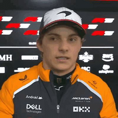 A Man Wearing A Mclaren Jacket And A Dell Jacket GIF