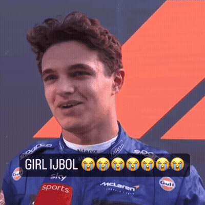A Man Wearing A Mclaren Jacket Is Talking Into A Microphone While Crying GIF
