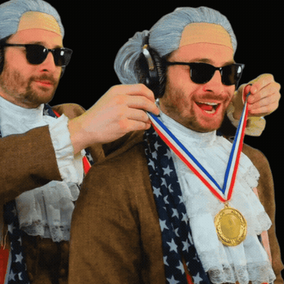 A Man Wearing A Medal Around His Neck That Says ' United States ' On It GIF