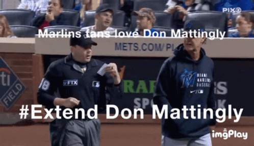 A Man Wearing A Miami Marlins Sweatshirt Walks Towards Another Man GIF