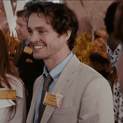 A Man Wearing A Name Tag That Says Chris Morgan On It GIF