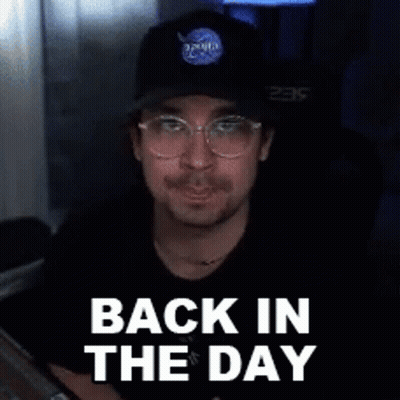 A Man Wearing A Nasa Hat And Glasses Is Smiling And Says Back In The Day . GIF