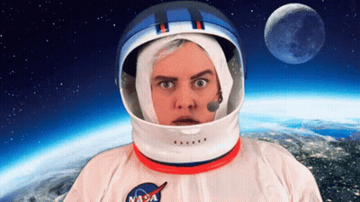A Man Wearing A Nasa Helmet And A Nasa Shirt GIF