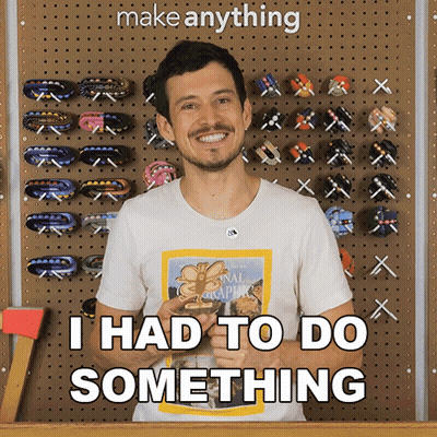 A Man Wearing A National Geographic Shirt Says " I Had To Do Something " In Front Of A Wall Of Hair Clips GIF