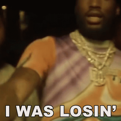 A Man Wearing A Necklace And A T-Shirt Is Saying I Was Losin ' GIF