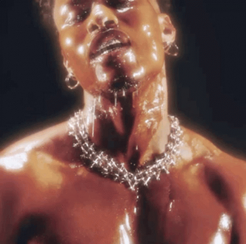 A Man Wearing A Necklace With Barbed Wire Around His Neck GIF