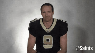 A Man Wearing A New Orleans Saints Jersey Is Making A Face . GIF