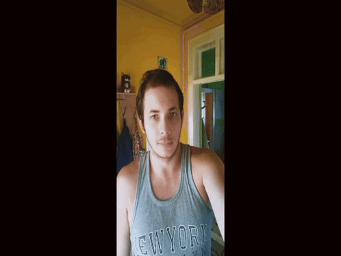 A Man Wearing A New York Brooklyn Tank Top GIF