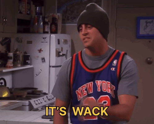 A Man Wearing A New York Jersey Is Standing In A Kitchen GIF