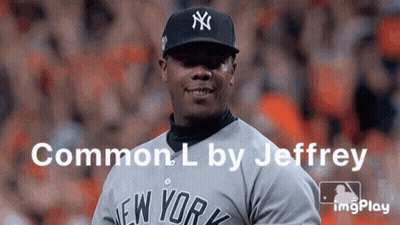 A Man Wearing A New York Yankees Baseball Uniform GIF