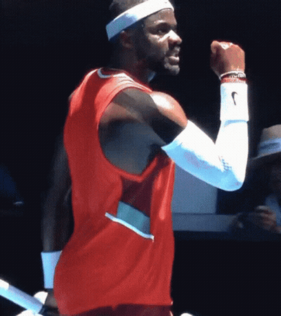 A Man Wearing A Nike Headband And A Red Shirt GIF