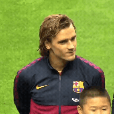 A Man Wearing A Nike Jacket With A Fc Barcelona Logo On It GIF
