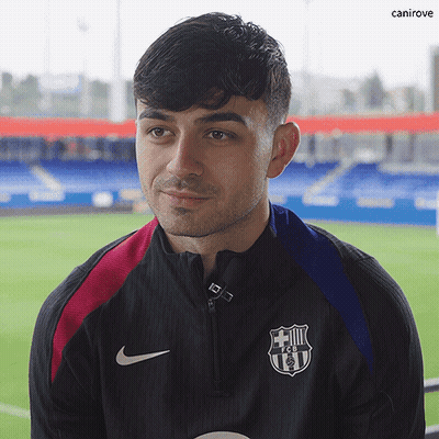 A Man Wearing A Nike Jacket With A Fcb Logo On The Front GIF