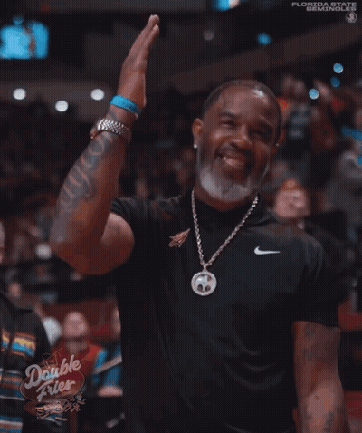 A Man Wearing A Nike Shirt And A Double Fries Sign GIF