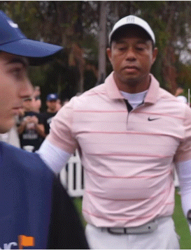A Man Wearing A Nike Shirt Is Talking To Another Man In A Blue Hat GIF