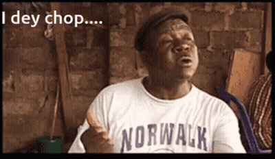 A Man Wearing A Norwalk Shirt Holds A Sandwich In His Hand GIF