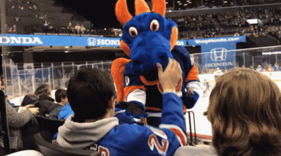 A Man Wearing A Number 22 Jersey Petting A Blue Dragon Mascot GIF