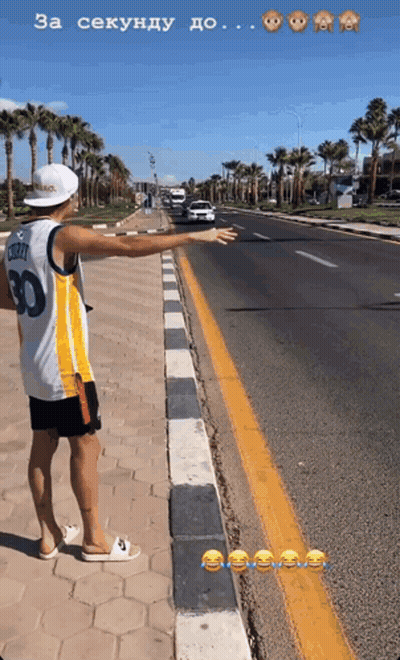 A Man Wearing A Number 30 Jersey Is Standing On The Side Of A Road GIF