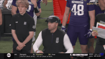 A Man Wearing A Number 48 Jersey Stands On A Football Field GIF