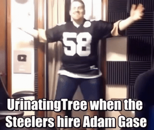 A Man Wearing A Number 58 Jersey Is Dancing In A Room GIF