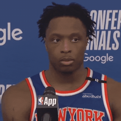 A Man Wearing A Ny York Jersey Stands In Front Of A Microphone GIF