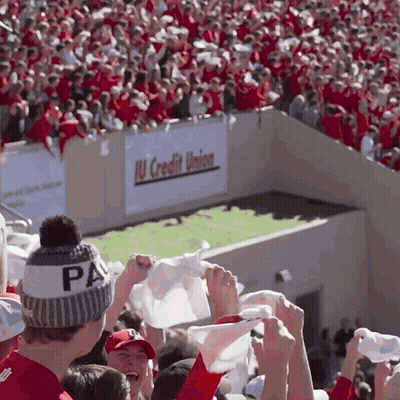 A Man Wearing A Pa Hat Holds Up A White Flag GIF