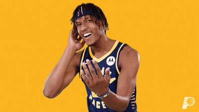 A Man Wearing A Pacers Jersey Is Laughing GIF