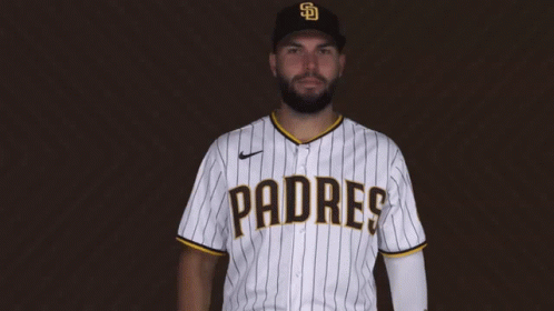 A Man Wearing A Padres Jersey Is Giving A Thumbs Up GIF