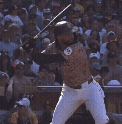 A Man Wearing A Padres Jersey Stands In A Crowd GIF