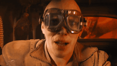 A Man Wearing A Pair Of Goggles Looks At The Camera With His Mouth Open GIF