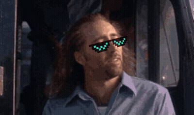 A Man Wearing A Pair Of Pixelated Sunglasses Looks To His Left GIF