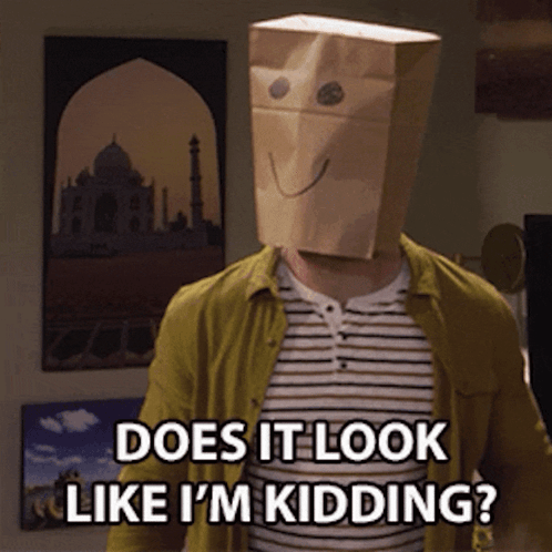 A Man Wearing A Paper Bag On His Head Says Does It Look Like I 'M Kidding GIF