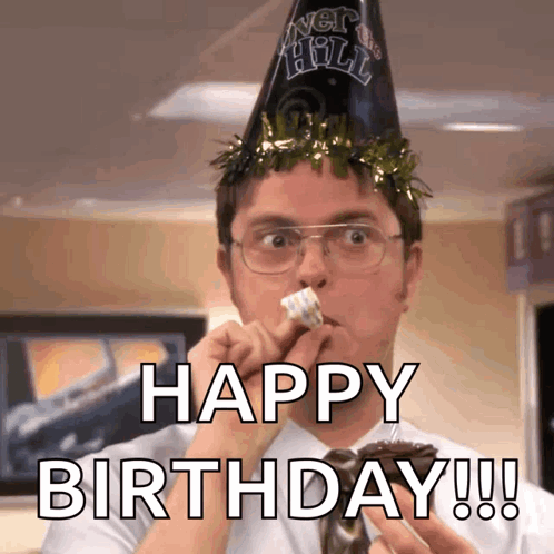 A Man Wearing A Party Hat Is Eating A Piece Of Cake With The Words Happy Birthday Written Below Him GIF
