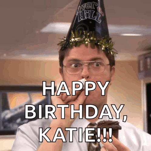 A Man Wearing A Party Hat Is Holding A Cupcake And Wishing Katie A Happy Birthday GIF