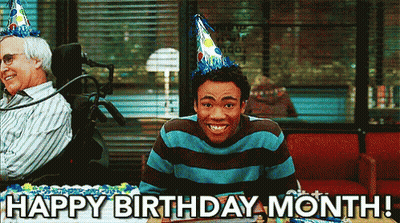 A Man Wearing A Party Hat Is Sitting In Front Of A Birthday Cake With The Words Happy Birthday Month Written On It GIF