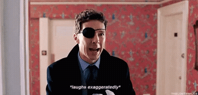 A Man Wearing A Patch On His Eye Is Laughing Exasperatedly . GIF