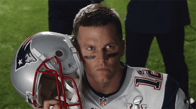 A Man Wearing A Patriots Jersey Holds A Helmet GIF